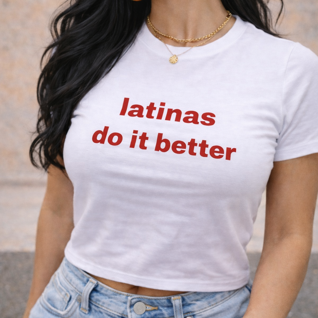 Woman wearing a white t-shirt with 'latinas do it better' text.